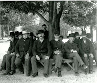 Old men resting under a tree