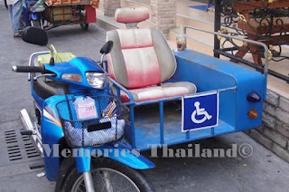 Turn your moped in Thailand into a sidecar, put half an armchair in it and turn it into a disabled transport