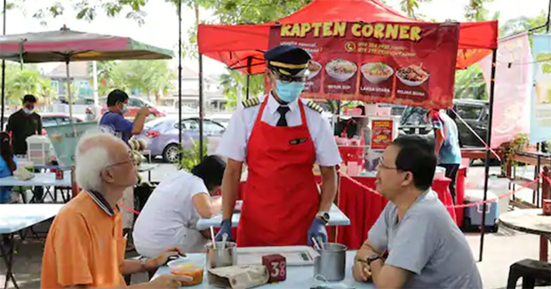 Why did the Malaysian pilot start selling noodles instead of flying in uniform?