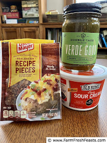 image of ingredients used to level up Instant Pot Meal Prep Breakfast Bowls--cooked bacon pieces, salsa, and sour cream