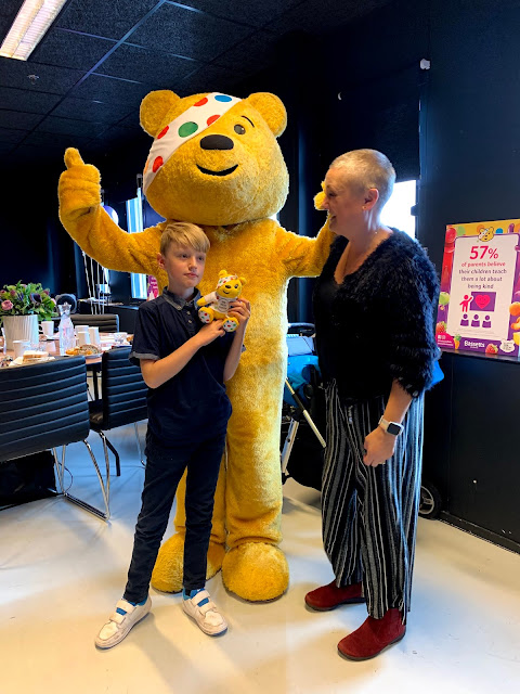 madmumofof7 and son with Pudsey Bear mascot