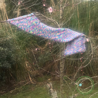 Picture of garden scarf drapped over a tree