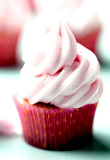 Gluten-free almond and raspberry cupcakes with raspberry swirl frosting