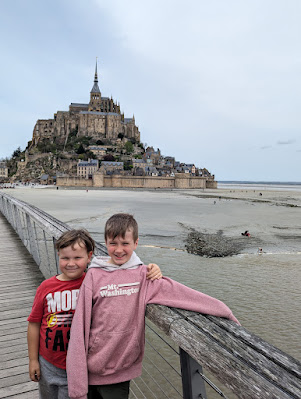 Boys with Mont St Michel in the background