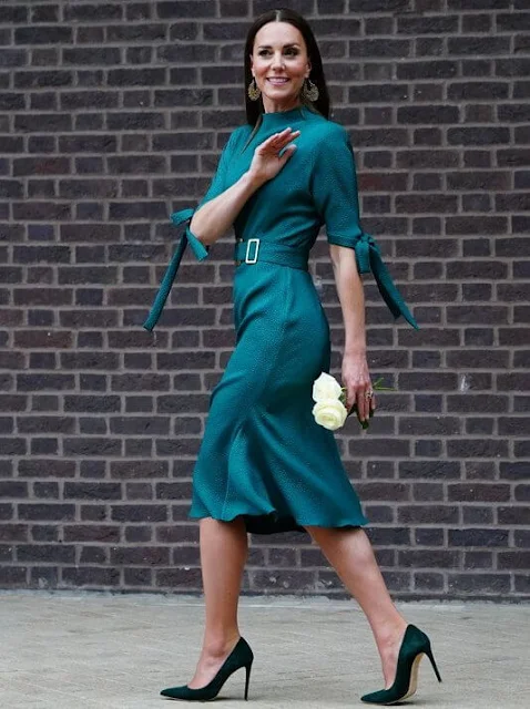 Kate Middleton wore a belted dress from Canadian designer Edeline Lee. Nadia Irena Maya earrings. Emmy London Rebecca pumps