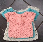 http://www.ravelry.com/patterns/library/little-molls-dress--cardigan-set---3-sizes