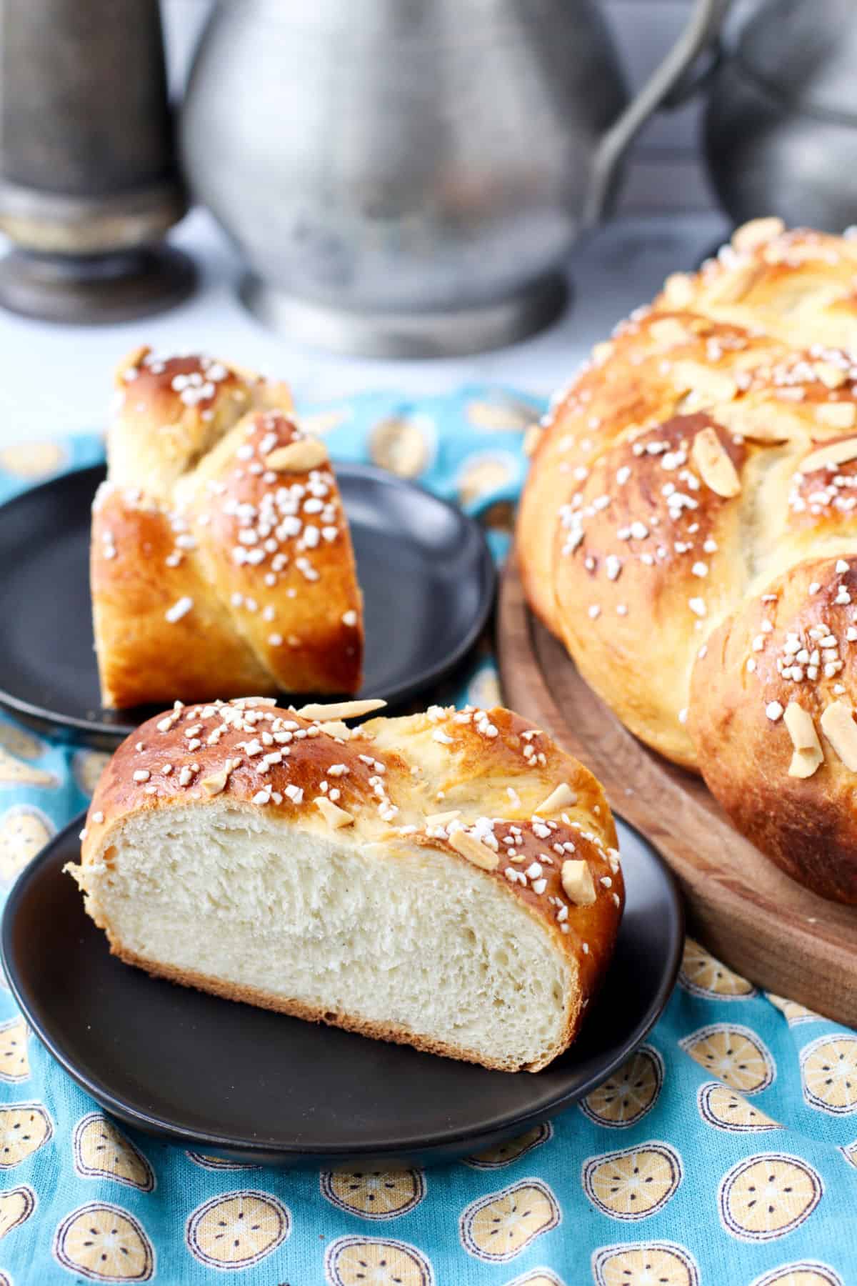 Finnish Cardamon Pulla Bread on black plates.