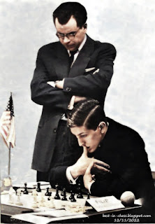 Stockholm. The U.S. candidates Pal Benko and Bobby Fischer examine an Interzonal position.