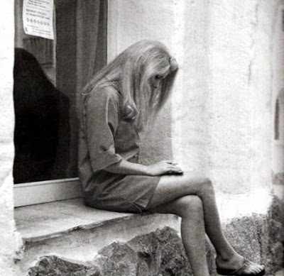 Catherine Deneuve reading on Sardinia photograph Nello Di Salvo via Vogue 