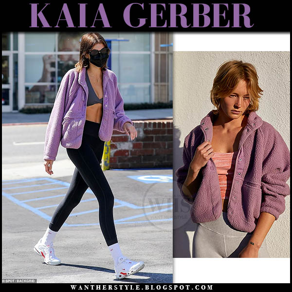 Kaia Gerber in purple fleece jacket and black leggings