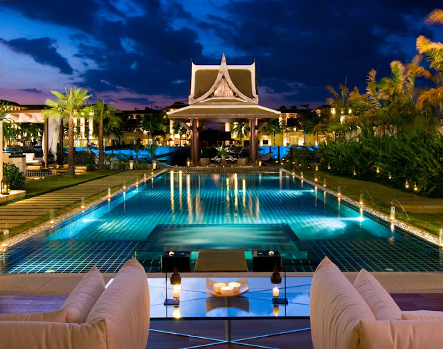 Picture of large square swimming pool at night