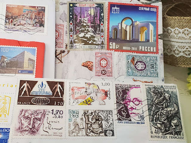 Postage stamps on envelopes from all over the world.