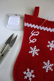 sewing on a stocking, monogram on a stocking, felt stocking, stocking embroidery