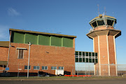 The Sydney Airport Terminal Control Unit at Mascot sits close to the runways . (sydney airport terminal control unit)