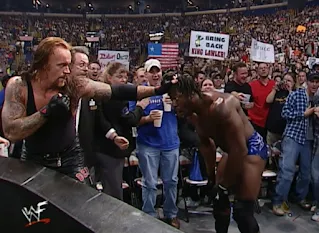 WWE / WWF No Mercy 2001 - The Undertaker ready to strike Booker T