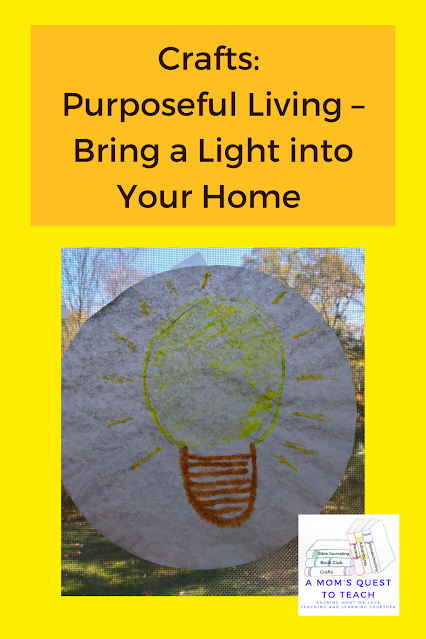 A Mom's Quest to Teach logo: Crafts: Purposeful Living – Bring a Light into Your Home - light bulb on coffee filter hanging in window