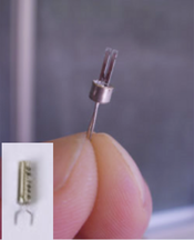 tiny quartz tuning fork used in clocks and watches