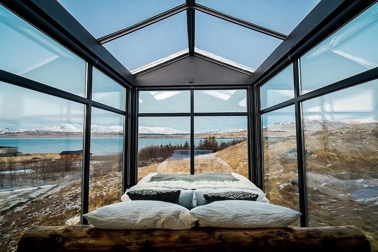 Cabin With Glass Walls In Iceland Lets Visitors Gaze At The Northern Lights While Laying In Their Bed