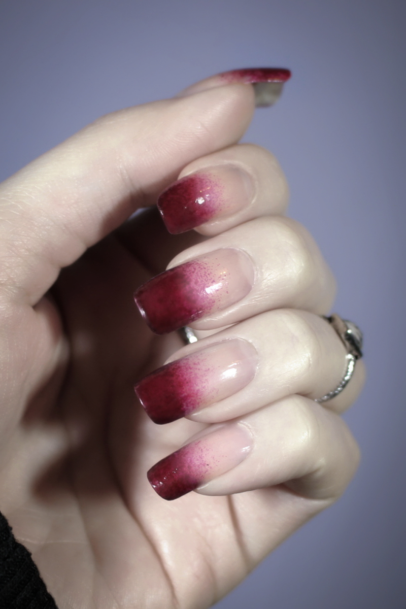 close-up of a female hand with Blood-Stained  Halloween nail look