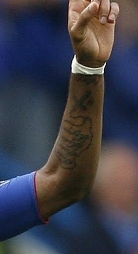 didier drogba tattoo. Drogba is Catholic although