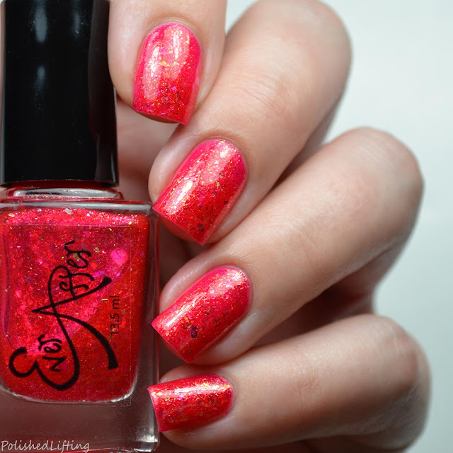 red jelly nail polish with shifting flakies