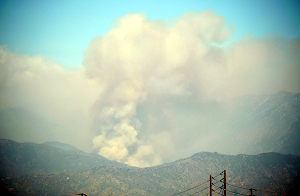 A smoke cloud emerges as the Bobcat Fire flares back up in the San Gabriel Mountains...as seen from the city of Industry in California on September 19, 2020.