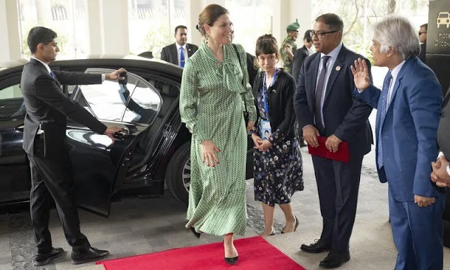 Crown Princess Victoria wore an Olga dress by Dea Kudibal. The Crown Princess arrived at the InterContinental Hotel in Dhaka