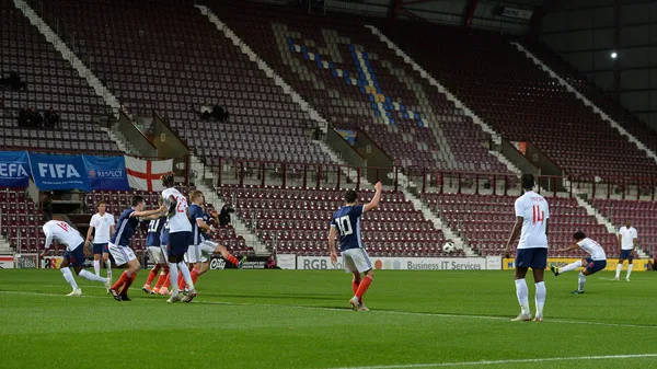 Reiss Nelson of England U21 scores his team's first goal during the 2019 UEFA European Under-21 Championship Qualifier match between Scotland U21 and England U21 at Tynecastle Stadium on October 16, 2018 in Glasgow, Scotland