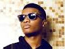 Wizkid Pours Drink on Fan at a London Bar