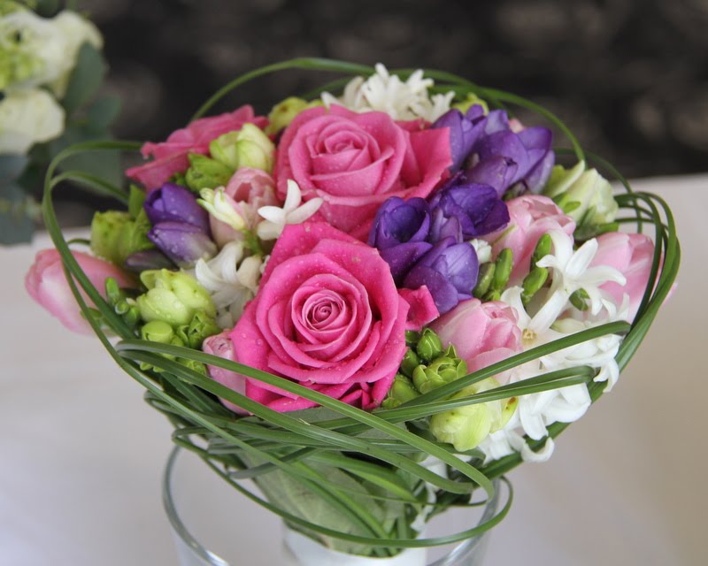 A sugary Pink and Lilac spring wedding bouquet of fragrant Freesia 