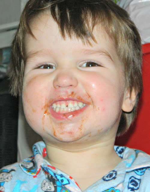 Small boy toddler chocolate face