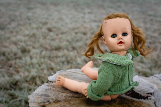 Baby doll looks to you on opposite face