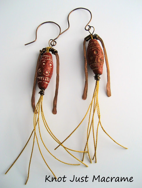 Earrings by Sherri Stokey of Knot Just Macrame using handcrafted brass findings, trade beads and cord.