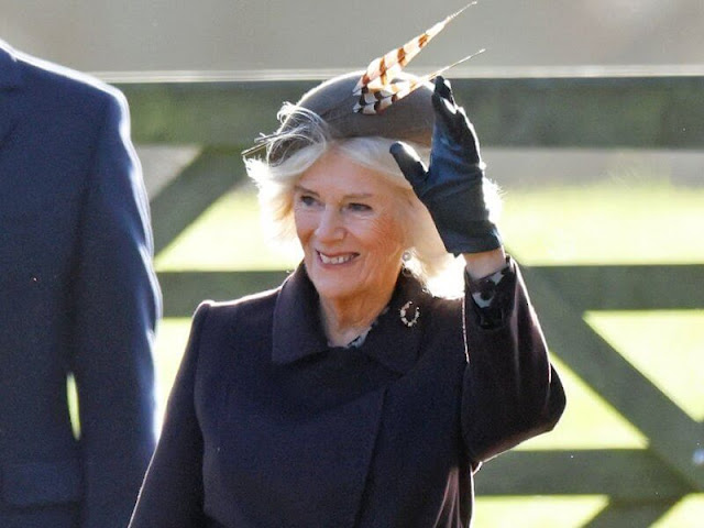 Queen Camilla wore a Manuela ultramarine coat by Max Mara. DeMellier mini Venice bag in forest grain
