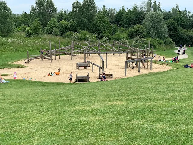 Sand pit with wooden play frames at Great Notley Park near braintree in Essex