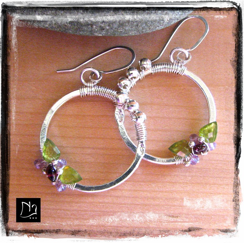 http://www.nathalielesagejewelry.com/collections/sterling-silver-designer-earrings/products/flower-earrings-august