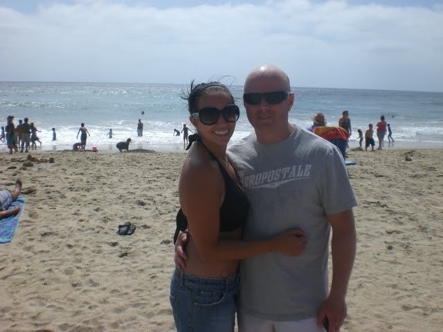 people walking on beach holding hands. Walking down the each holding