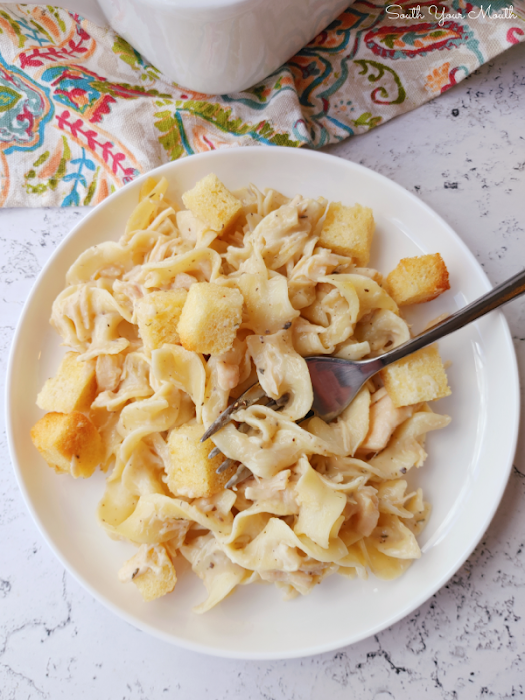 Cupboard Casserole! A super quick and easy casserole recipe using canned chicken, egg noodles and cream soup – all items from your cupboard or pantry! – topped with buttered bread cubes then baked until toasty.