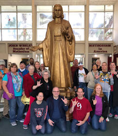 Many of the SEJ group posed for a picture a large John Wesley statue that is made of chocolate.