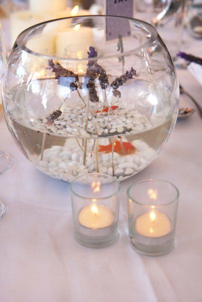 beautiful crystal and glass fish bowl decor ideas for wedding table on the venue