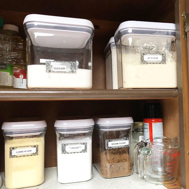 an organized kitchen pantry with baking ingredients in oxo containers
