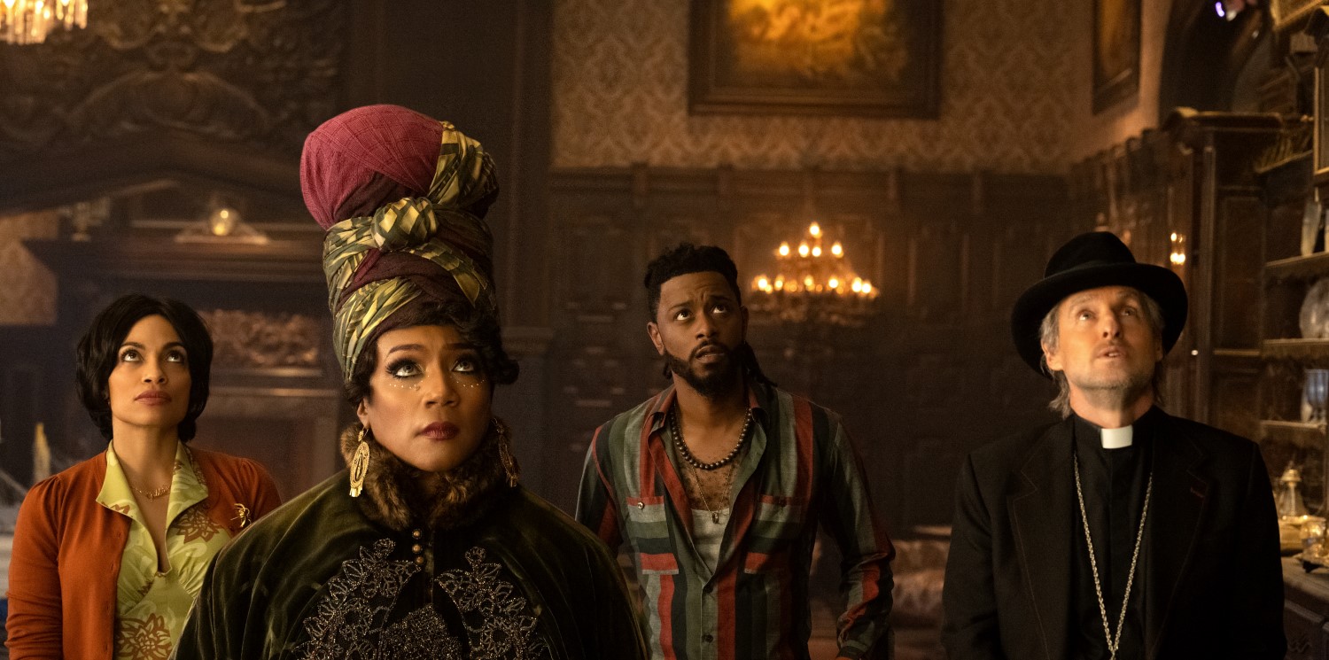 (L-R): Rosario Dawson as Gabbie, Tiffany Haddish as Harriet, LaKeith Stanfield as Ben, and Owen Wilson as Father Kent in Disney's live-action HAUNTED MANSION. Photo Jalen Marlowe. © 2023 Disney Enterprises, Inc. All Rights Reserved.