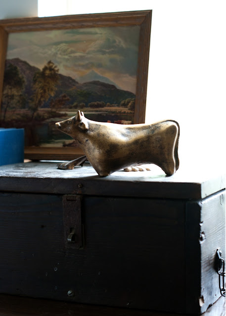 brass cow, small landscape, cigar box