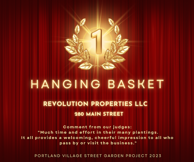 1st place - Hanging Basket- Revolution Properties LLC - 280 Main Street. Comment from our judges:  "Much time and effort in their many plantings. It all provides a welcoming, cheerful impression to all who  pass by or visit the business."