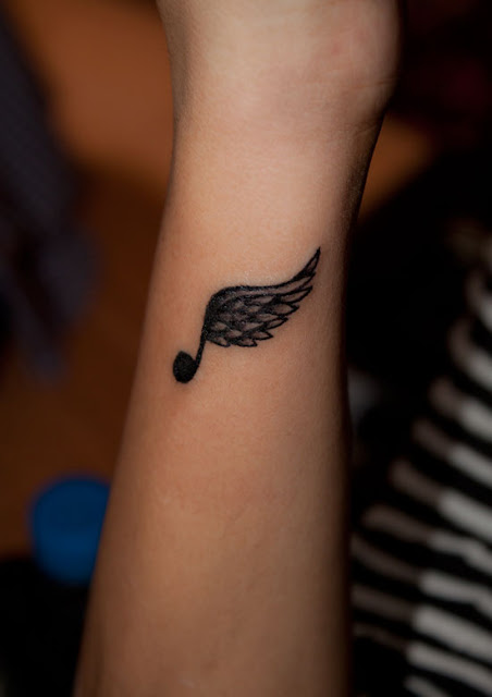 Tattoos Designs, Pictures And Ideas: Musical Wing Tattoo On Arm