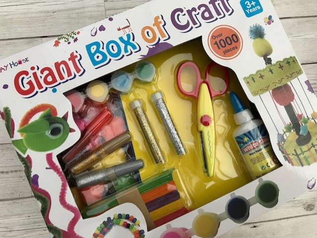 Front of the box filled with craft supplies