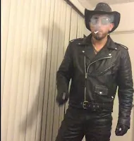 Cowboy wearing a leather biker jacket and pants smoking cigarette or sunglasses