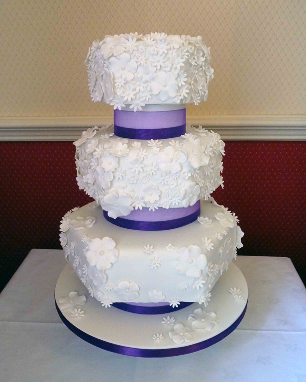 4tierWhiteFlowersHexagonWeddingCakePURPLE