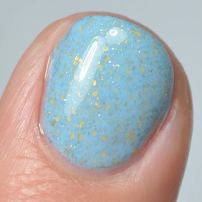 light blue creme with gold flecks swatch