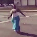 Watch the Hilarious Moment a Lady's Gigantic Boobs Popped-out from Her Dress While Dancing on the Road (Photos+Video)